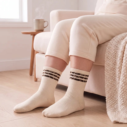 Cream crew socks with leopard stripes worn