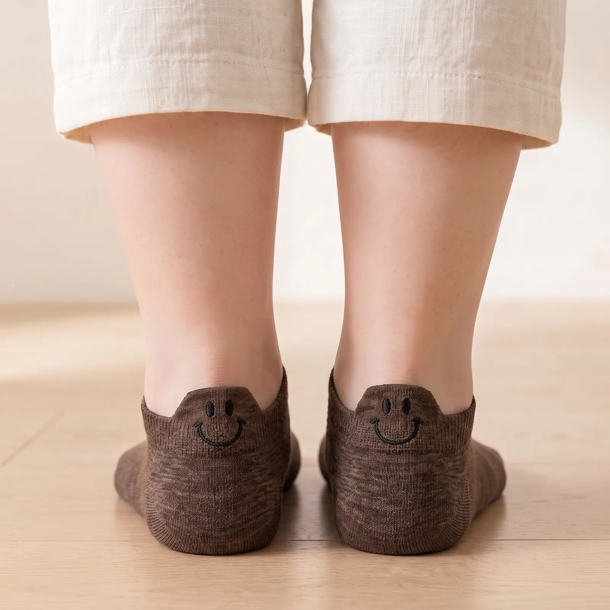 Brown smile ankle socks worn