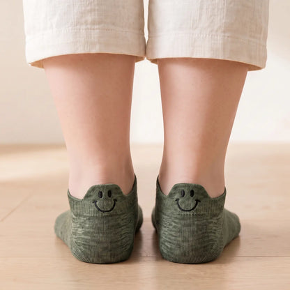 Green smile ankle socks worn