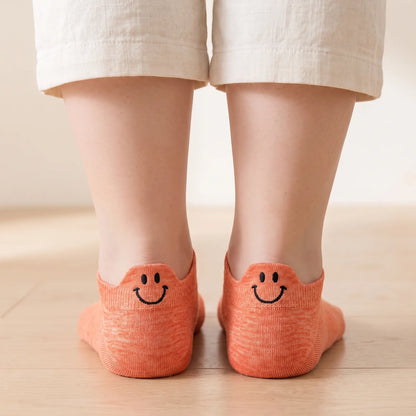 Orange smile ankle socks worn