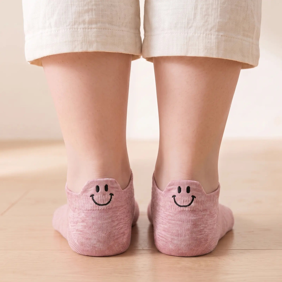 Pink smile ankle socks worn