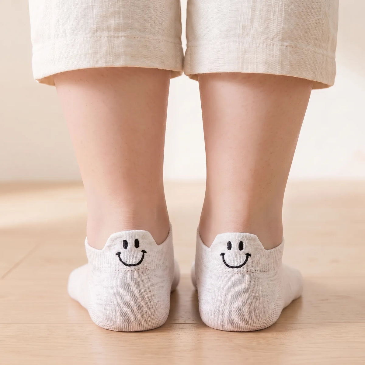 White smile ankle socks worn