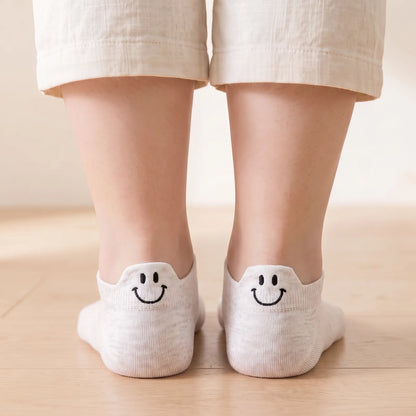 White smile ankle socks worn